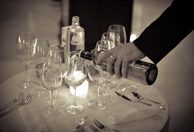  pouring wine into a cup 